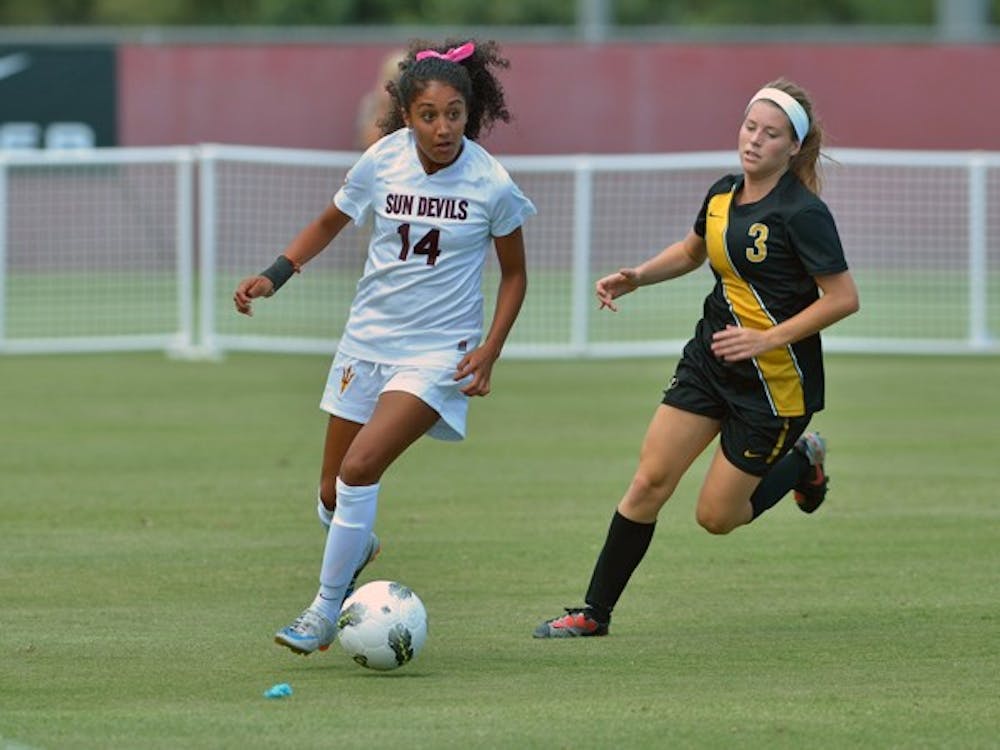 TAKING STEPS: Senior midfielder Nicole Acosta moves the ball downfield in the Sun Devils’ loss to the Tigers on Sept. 11. Acosta is one of the many players on the soccer team that were switched around in the starting lineup since the beginning of the season. (Photo by Aaron Lavinsky)