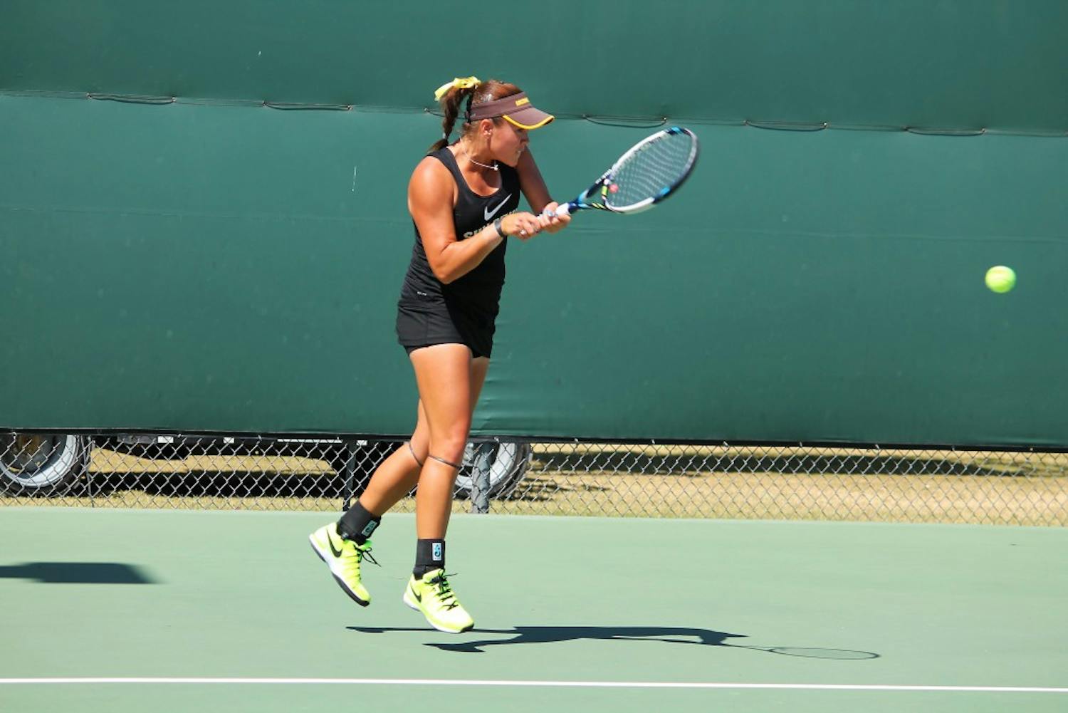 ASU Sophomore Kassidy Jump returns with a backhand during 6-4 6-