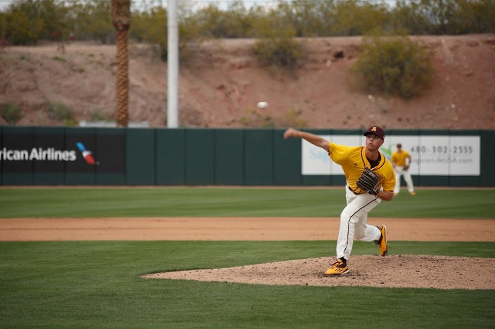 Sophomore Ryan Hingst (#17) delivers a pitch against Eastern Michigan University at Phoenix Municipal Stadium on March 6, 2016.&nbsp;