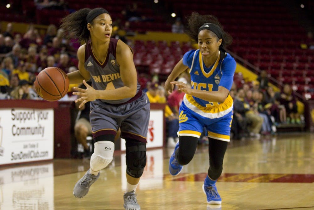 ASU freshman guard Kiara Russell (4) looks to drive to the basket during a women's basketball game against the no. 15 ranked UCLA Bruins in Wells Fargo Arena in Tempe, Arizona on Sunday, Feb. 26, 2017. ASU lost 55-52.  (Josh Orcutt/State Press)