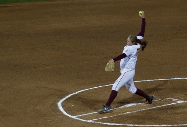Junior pitcher Dallas Escobedo rotates her arm one more time before launching a pitch against North Dakota on Feb. 28. Escobedo got the win but it was the team's bats that up 15 runs against UND.  (Photo by Dominic Valente)