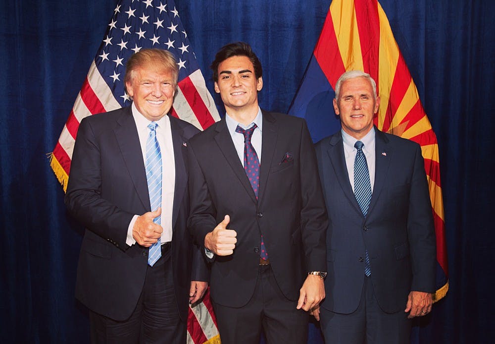 ASU student Danny Cox, who temporarily&nbsp;withdrew from the University to assist in Donald Trump's campaign for president, poses for a photo with Trump and his running&nbsp;mate Gov.&nbsp;Mike Pence.&nbsp;