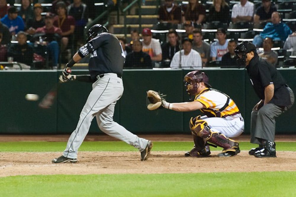 Long Beach State junior infielder Jonathan Serven hits a base hit to single in a run against Arizona State on Saturday, March 7, 2015 at Phoenix Municipal Stadium. The Dirtbags defeated the Sun Devils 4-2. (Ben Moffat/The State Press)