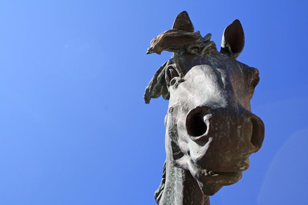 "Spirit," a sculpture of five horses by Buck McCain, stands majestically in the spring sunshine outside the W.P. Carey School of Business on the Tempe campus. (Photo by Jessie Wardarski)