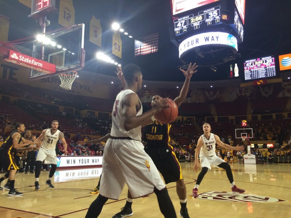 Sophomore guard Chance Murray is defended by Bethune Cookman senior guard Maurice Taylor while attempting to inbound the ball in the second half of ASU's 49-39 win over the Wildcats at Wells Fargo Arena on Monday, Nov. 17, 2014.  (Photo by Stefan Modrich)