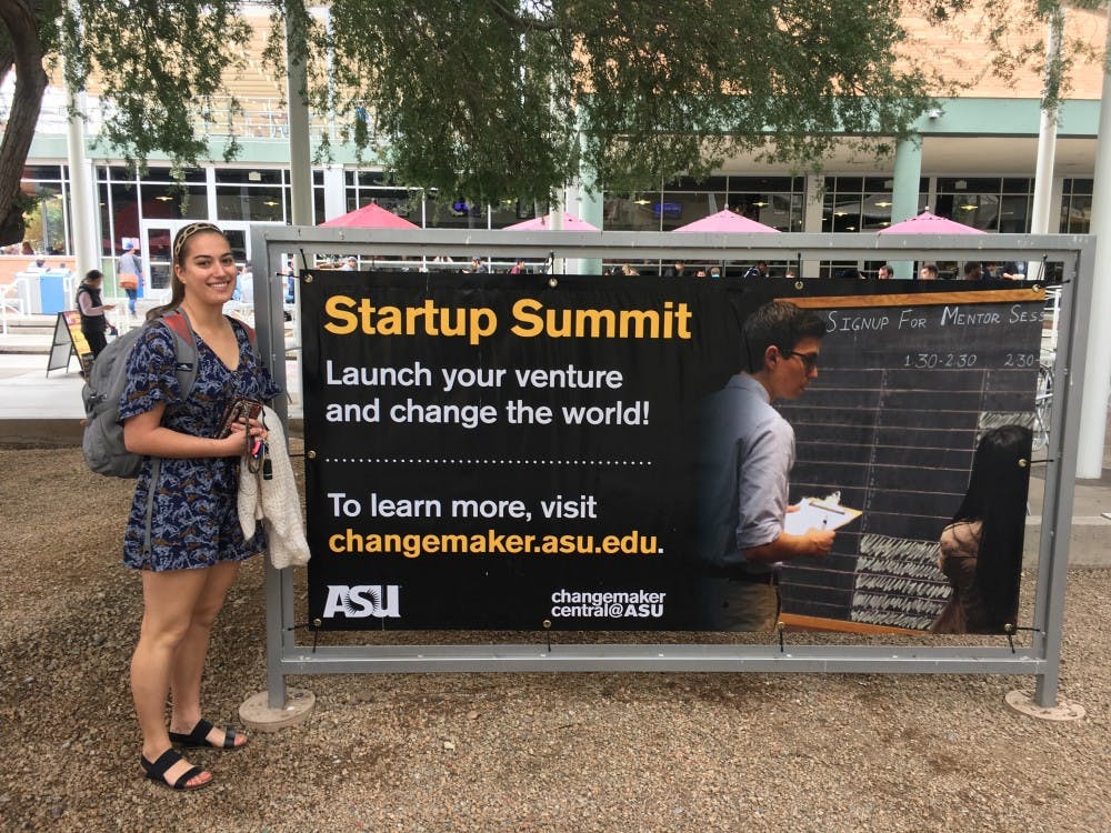 Tina Piarowski poses in front of Changemaker Central advertisement at ASU's Tempe, Arizona campus on Monday, Feb. 6, 2017.
