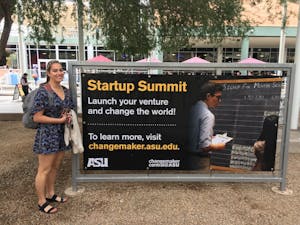 Tina Piarowski poses in front of Changemaker Central advertisement at ASU's Tempe, Arizona campus on Monday, Feb. 6, 2017.