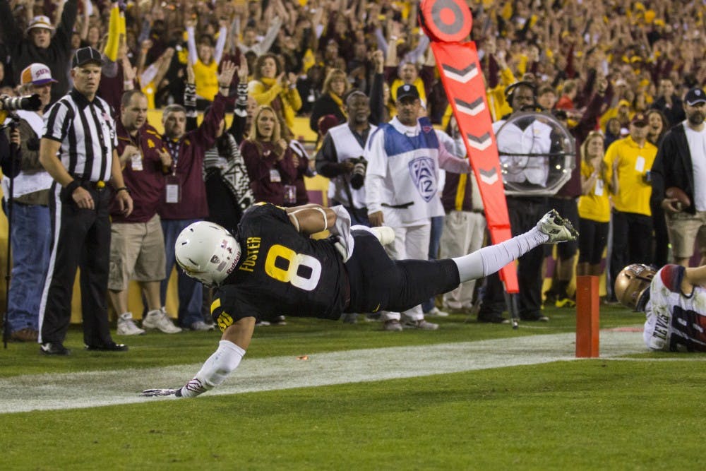 Sophomore running back D.J. Foster completes a touchdown in the game against UA. The Sun Devils lead the Wild Cats(Photo by Diana Lustig)