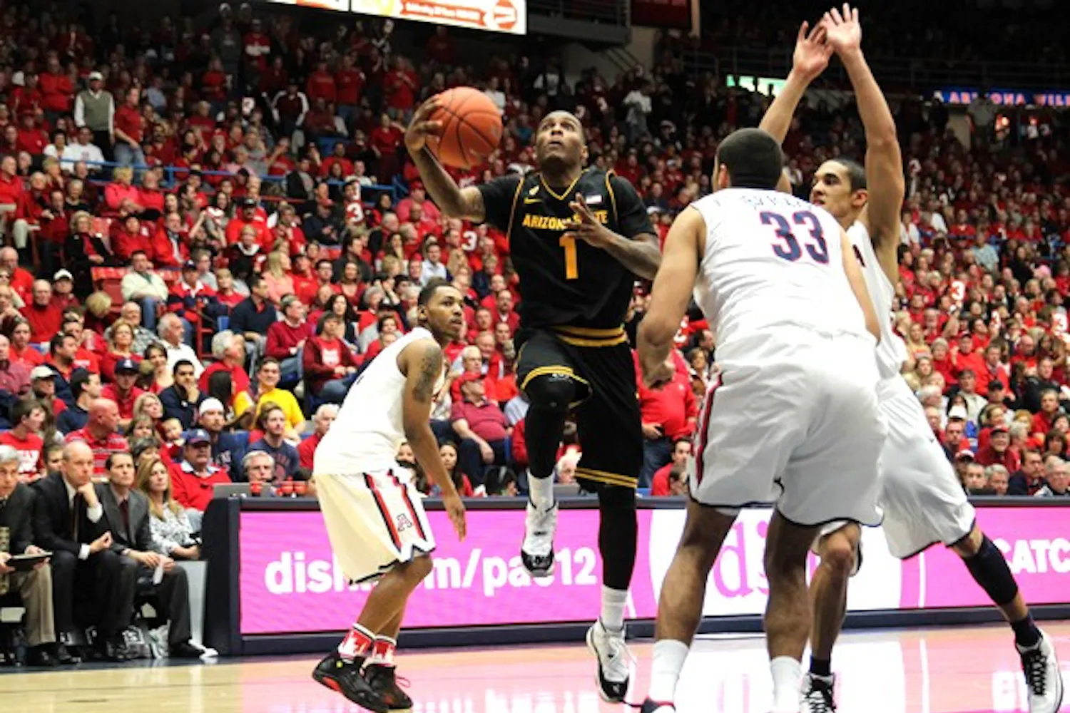 Redshirt junior guard Jahii Carson pushes off his left foot to put up a layup against UA on March 9. Carson loved the support the team received from ASU fans in Las Vegas for the Pac-12 tournament. (Photo by Dominic Valente)