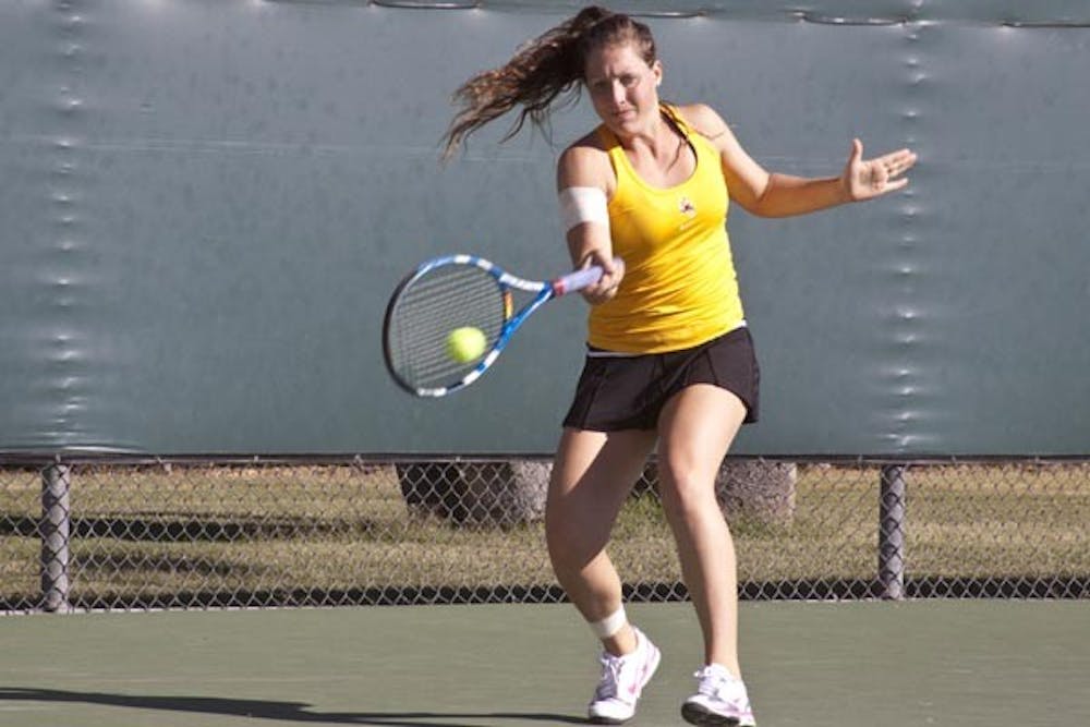 SWEET THING: Senior Kelcy McKenna returns a volley during the ASU Thunderbird Invitational on Sunday. McKenna took home the singles crown in the tournament, which ASU hosted, by topping Northwestern Freshman Belinda Niu. (Photo by Annie Wechter)