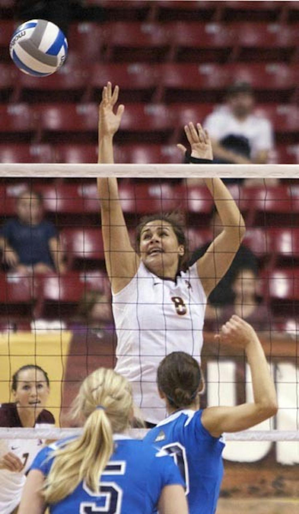 STUNNING SWEEP: Sophomore outside hitter Malia Marquardt attempts to block a return against No. 10 UCLA during ASU's 3-1 win Saturday. The Sun Devils also beat No. 5 USC on Friday, giving them their first sweep of the two schools in 15 years. (Photo by Scott Stuk)