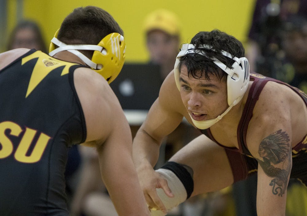 Redshirt freshman Mikel Perales competes against freshman Josh Kramer during an intrasquad match on Friday, Oct. 30, 2015, at Ritches Wrestling Complex in Tempe. Perales defeated Kramer 2-1.