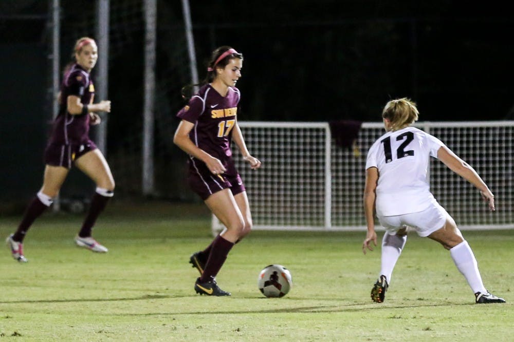 Sophomore forward Cali Farquharson maneuvers around a member of the Colorado soccer team in a game last season. Farquharson was named Pac-12 player of the week this week. (Photo by Arianna Grainey)
