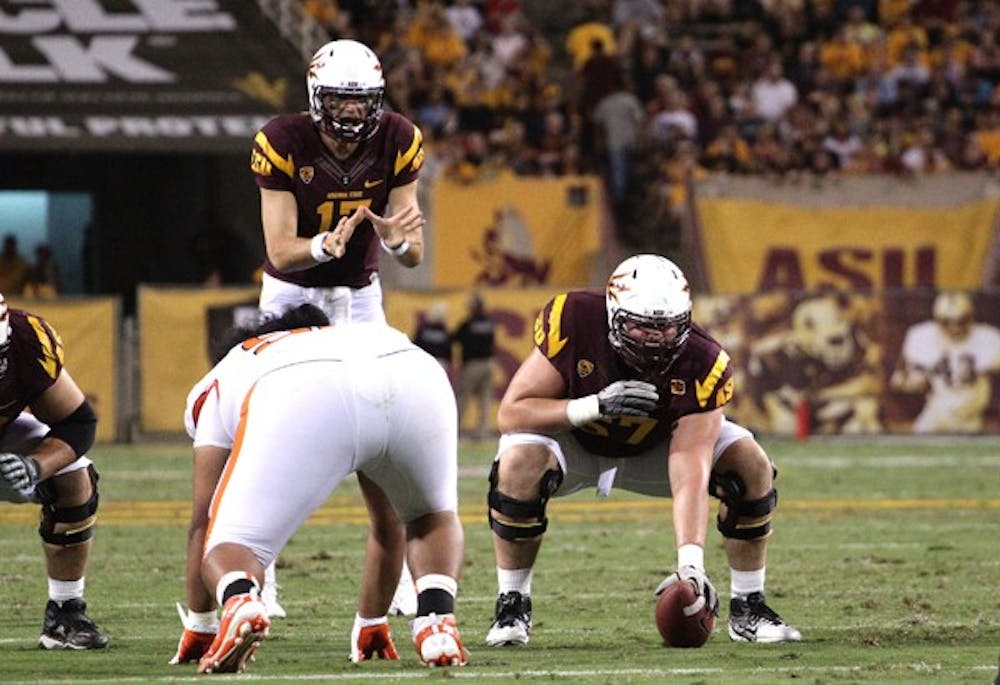 THE REPLACEMENT: Sophomore offensive lineman Kody Koebensky (67) waits to snap the ball to junior quarterback Brock Osweiler during the Sun Devils’ 35-20 win over Oregon State on Saturday. Koebensky will get the nod at center if Gerhart is unable to return. (Photo by Beth Easterbrook)