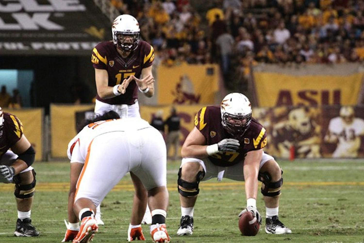 THE REPLACEMENT: Sophomore offensive lineman Kody Koebensky (67) waits to snap the ball to junior quarterback Brock Osweiler during the Sun Devils’ 35-20 win over Oregon State on Saturday. Koebensky will get the nod at center if Gerhart is unable to return. (Photo by Beth Easterbrook)