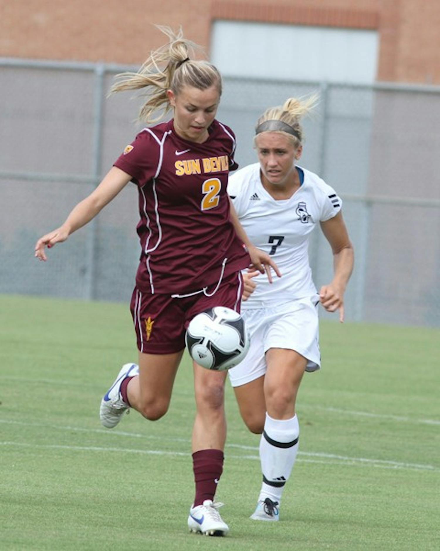 BOUNCE BACK: ASU freshman forward Alexandra Doller gets set to kick the ball away from Old Dominion senior defender Rachael Carroll on Sunday. The Sun Devils fell to 2-2 after losing to both the Monarchs and No. 4 Virginia on the first road trip of the season. (Photo courtesy of Steve Rodriguez)
