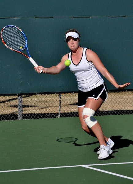 Well-rested: ASU sophomore Hannah James moves to return a ball against UC Davis freshman Kelly Chui during the Sun Devils’ 7-0 victory on Jan. 22. ASU faces NAU on Friday after taking last weekend off. (Photo by Sierra Smith)