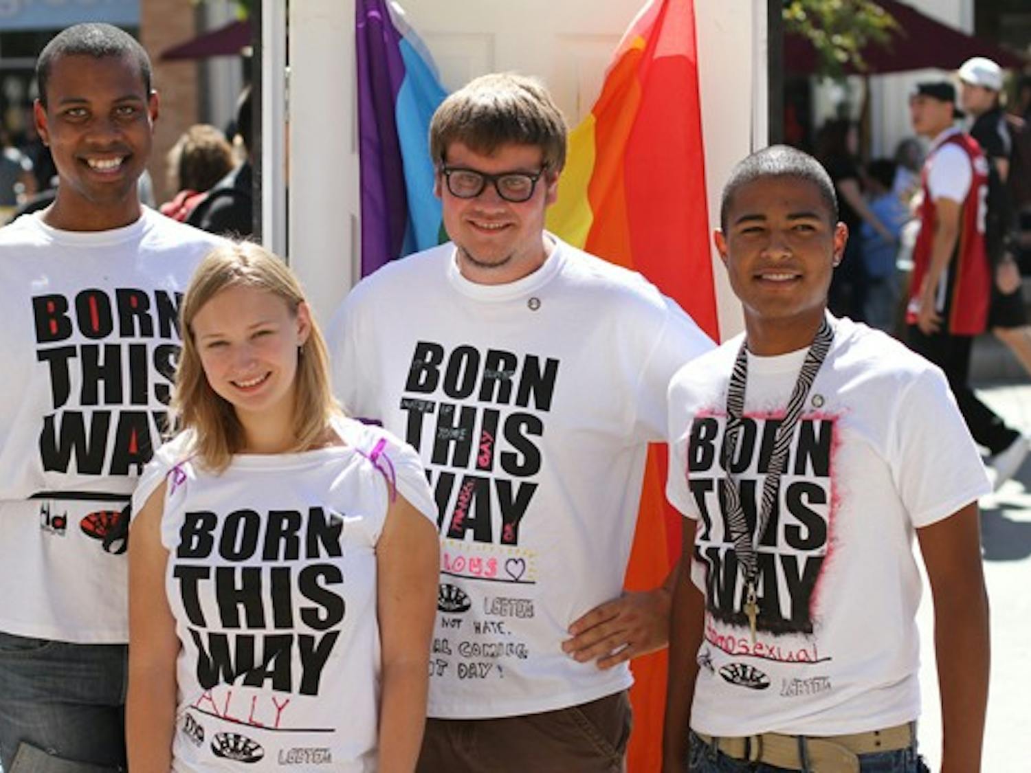 SHOWING PRIDE: Brian Fleming, Jackie Chikos, Oliver Migliore and Jessie Flores show off their "Born This Way" t-shirts outside of the Memorial Tuesday as part of the LGBTQA Coalition's Coming Out Day. (Photo by Lisa Bartoli)