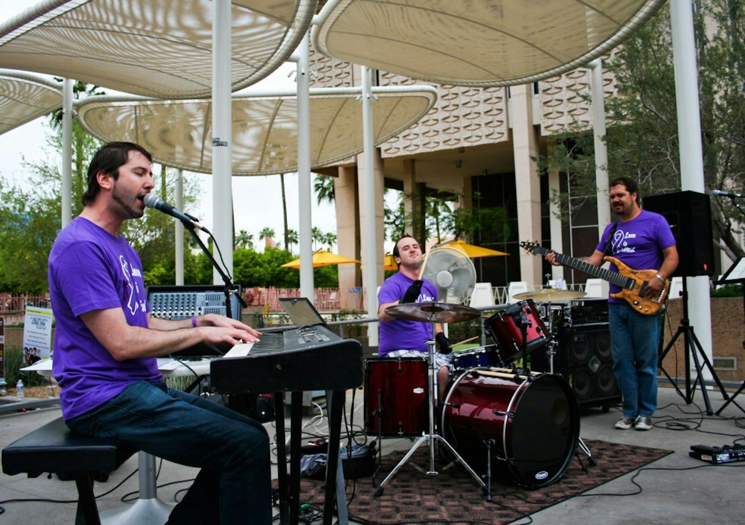 ROCKING AGAINST ABUSE: The band The Final performs at the Go Purple Concert in front of the Memorial Union to raise awareness and fight against domestic violence. (Photo by Lisa Bartoli)