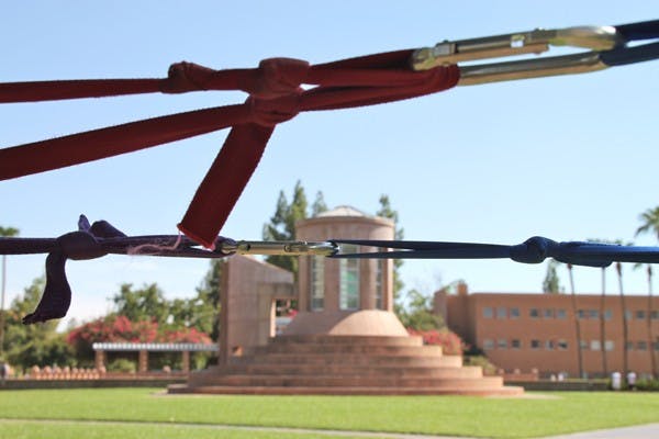 SLACKING OFF: The ASU Slack Devils set up lines on Hayden Lawn last week. (Photo by Rosie Gochnour
