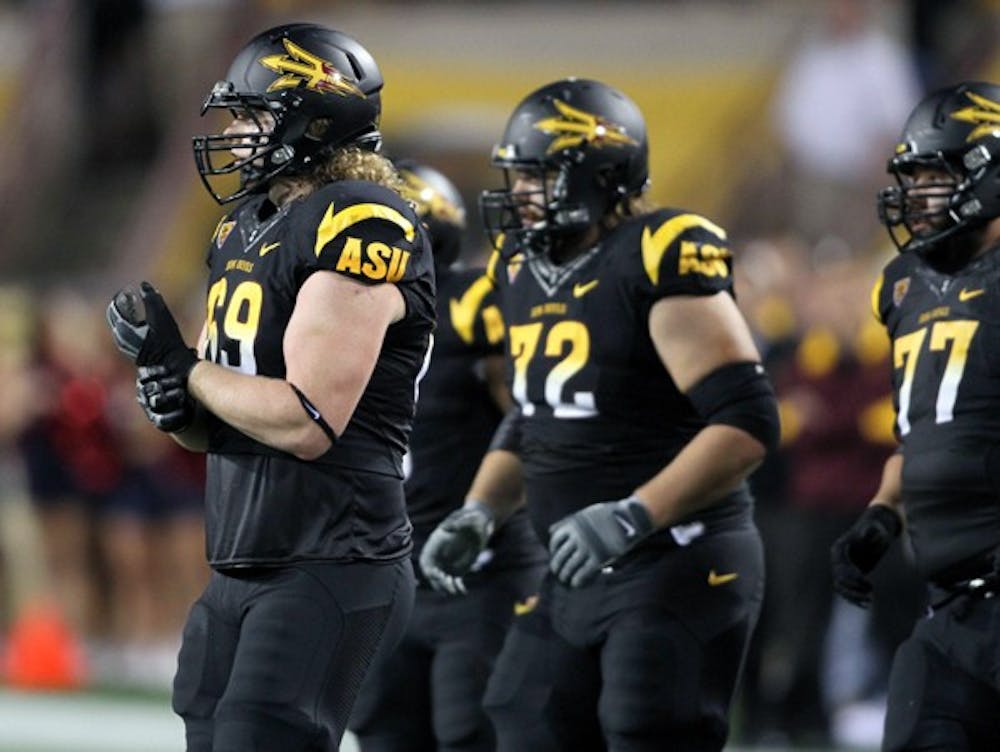 ASU senior offensive lineman Dan Knapp (69) walks up to the line of scrimmage during the Sun Devils’ loss to UA on Saturday. Knapp was converted from a tight end to a lineman early in his collegiate career. (Photo by Lisa Bartoli)