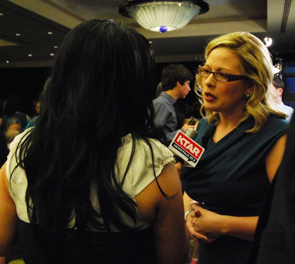 Kyrsten Sinema speaks with KTAR, while election results are reported on Tuesday evening.  (Photo by Murphy Bannerman)