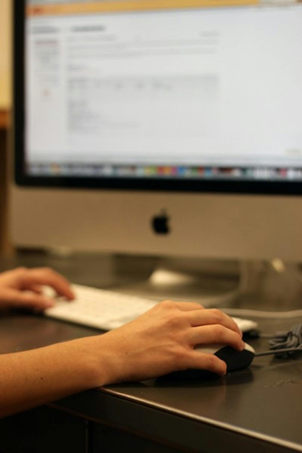 TECHNOLOGY: UA professor J.C. Mutchler believes Arizona's universities need to invest some time and money to teach professors how to use the technology that students are using. (Photo by Beth Easterbrook)