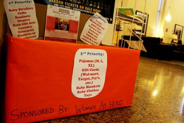 Woman As Hero is one of many student organizations that is collecting donations this holiday season. The group has set up stations around campus where the ASU community can donate clothes and apparel that will go to women refugees. (Photo by Jessie Wardarski)