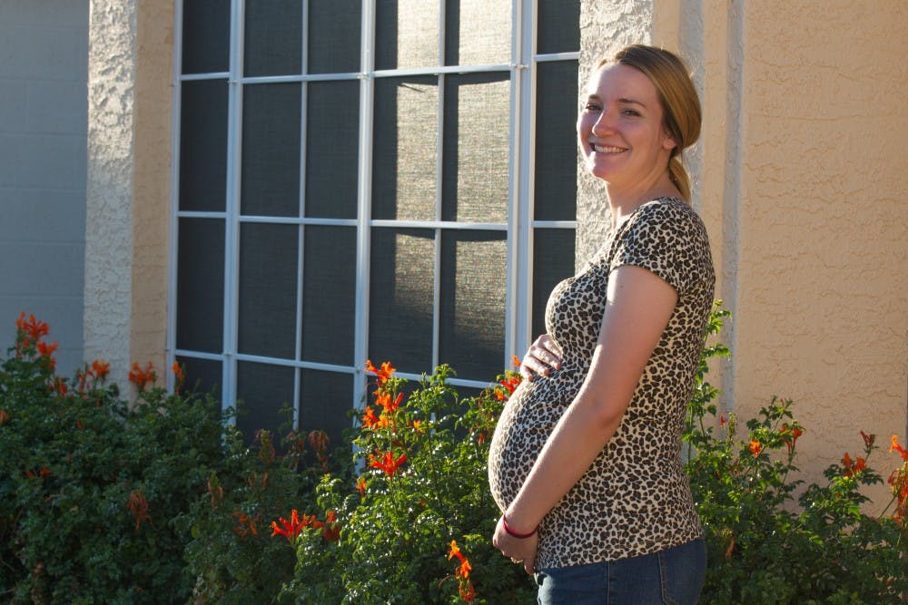 ASU human and family development&nbsp;senior&nbsp;Cassie Mortensen poses for a photo in her eighth month of pregnancy in Chandler, Arizona&nbsp;on Sunday, March 19, 2017.&nbsp;