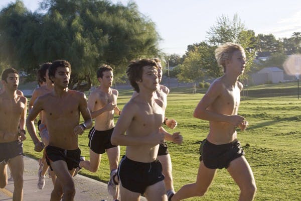 HIGH-ALTITUDE RUN: Members of the men’s cross country team run during a practice last year. Both the men’s and women’s teams open the season at the George Kyte Classic in Flagstaff on Saturday. (Photo by Annie Wechter)