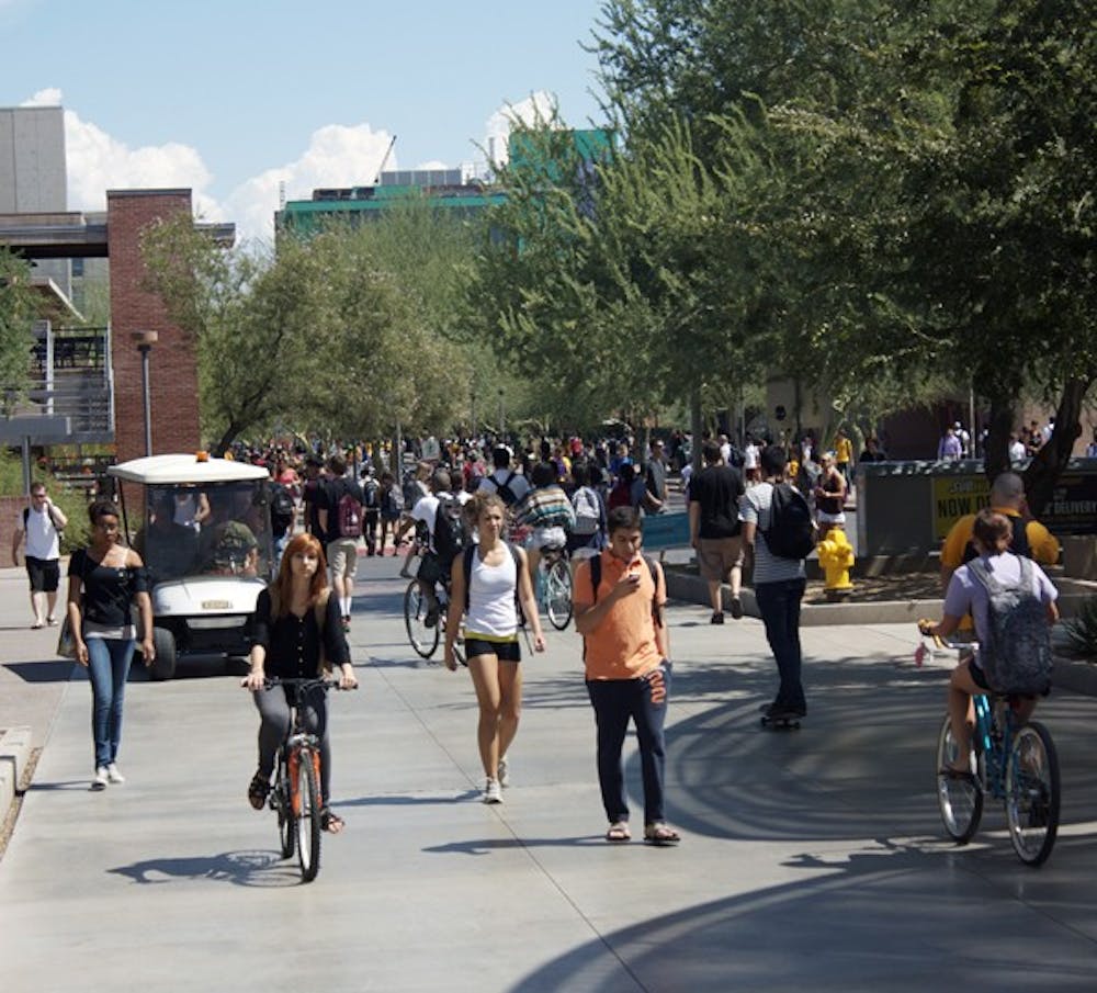 The Walk Your Wheels campaign is heating up this spring with an increase in signage around the Tempe campus, and is recruiting volunteers for a student committee aimed at increasing education about pedestrian safety. (Photo by Shawn Raymundo)