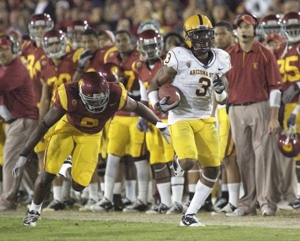GOING, GONE: ASU senior Omar Bolden runs the ball down the sideline after making an interception during the Sun Devils’ loss to USC last season. Despite being sidelined for the year due to injury, Bolden remains an integral part of the team. (Photo by Scott Stuk)
