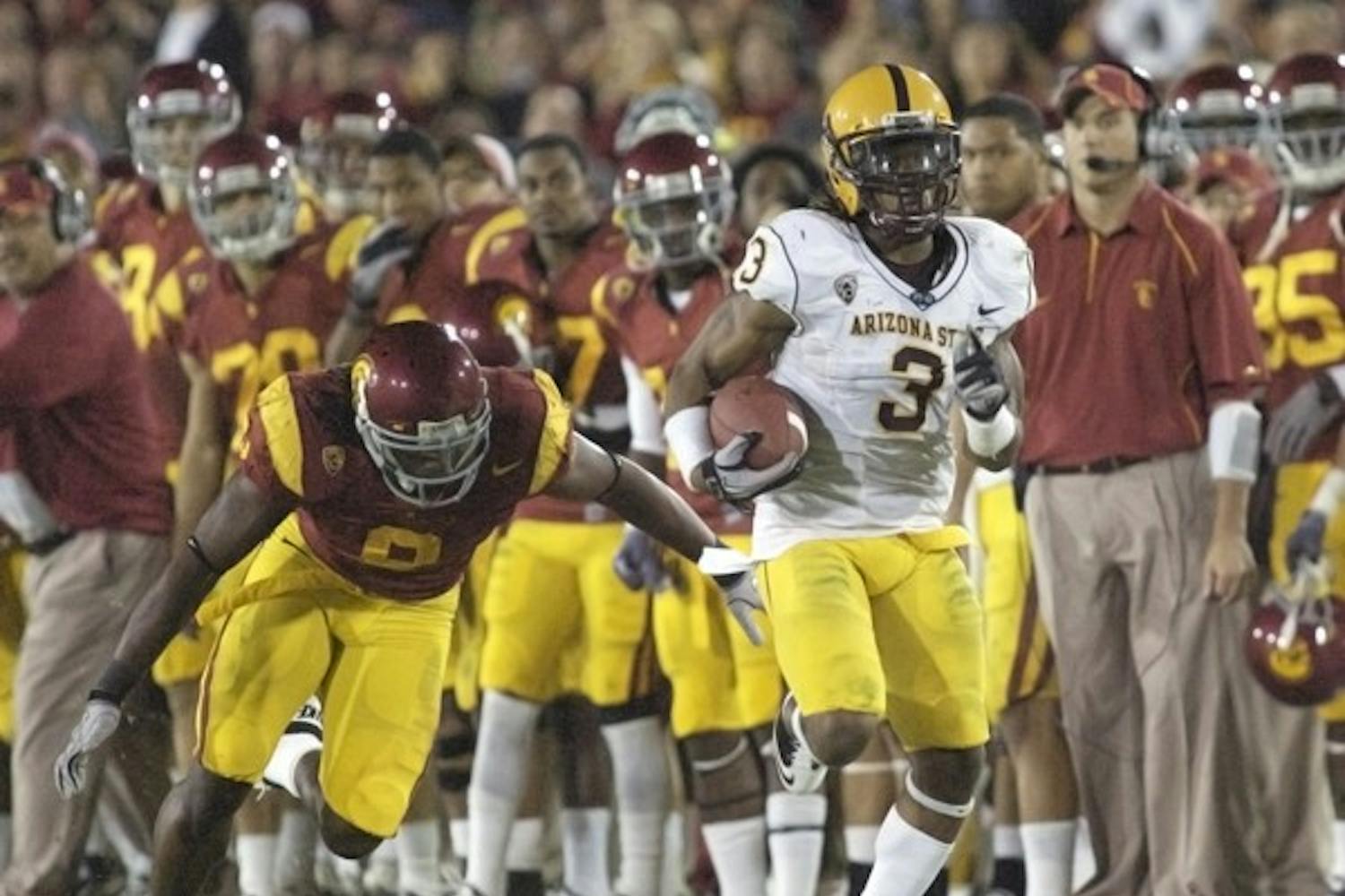 GOING, GONE: ASU senior Omar Bolden runs the ball down the sideline after making an interception during the Sun Devils’ loss to USC last season. Despite being sidelined for the year due to injury, Bolden remains an integral part of the team. (Photo by Scott Stuk)