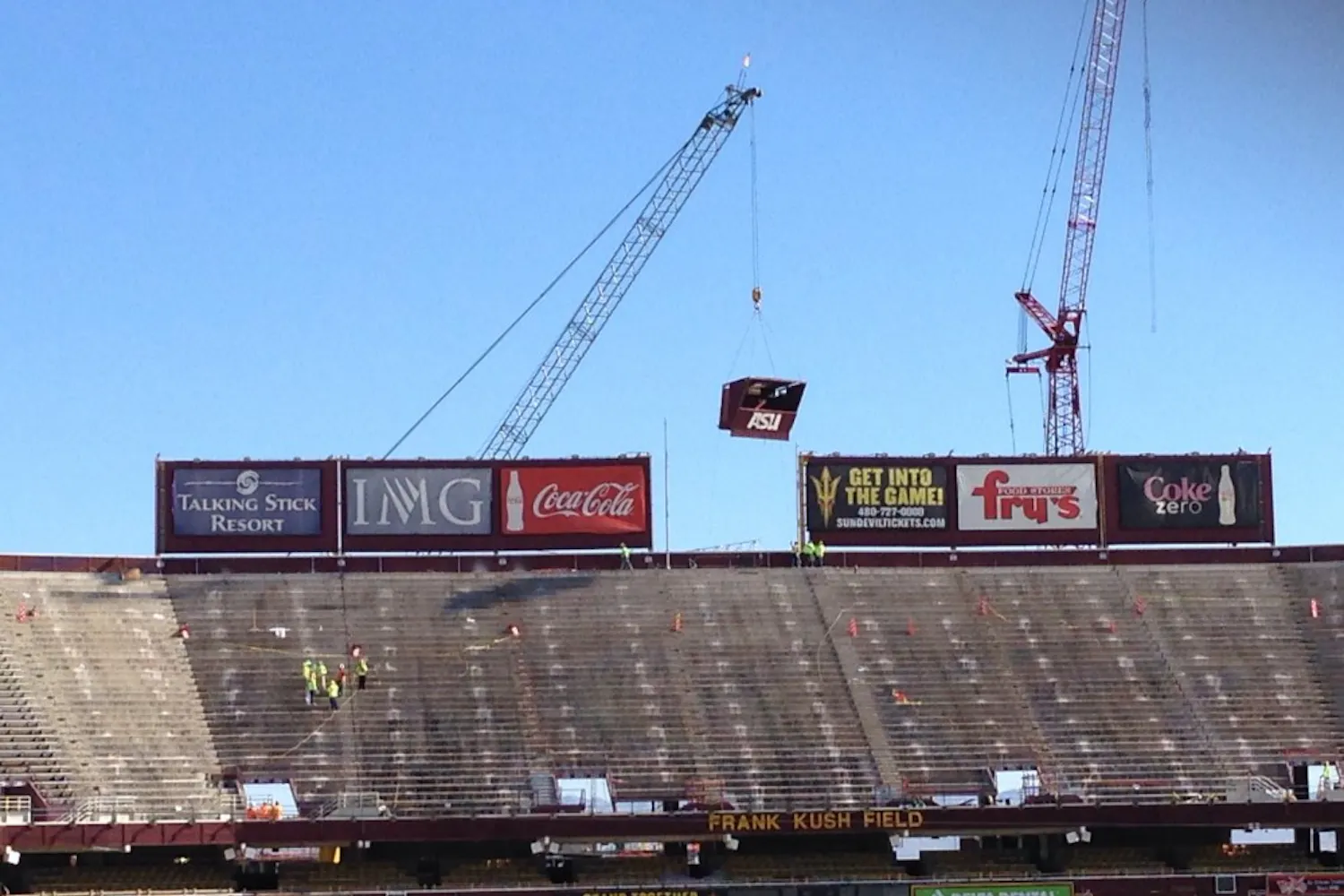 Construction crews begin removing the upper deck of Sun Devil Stadium on Monday, April 14. (Photo by Josh Nacion)
