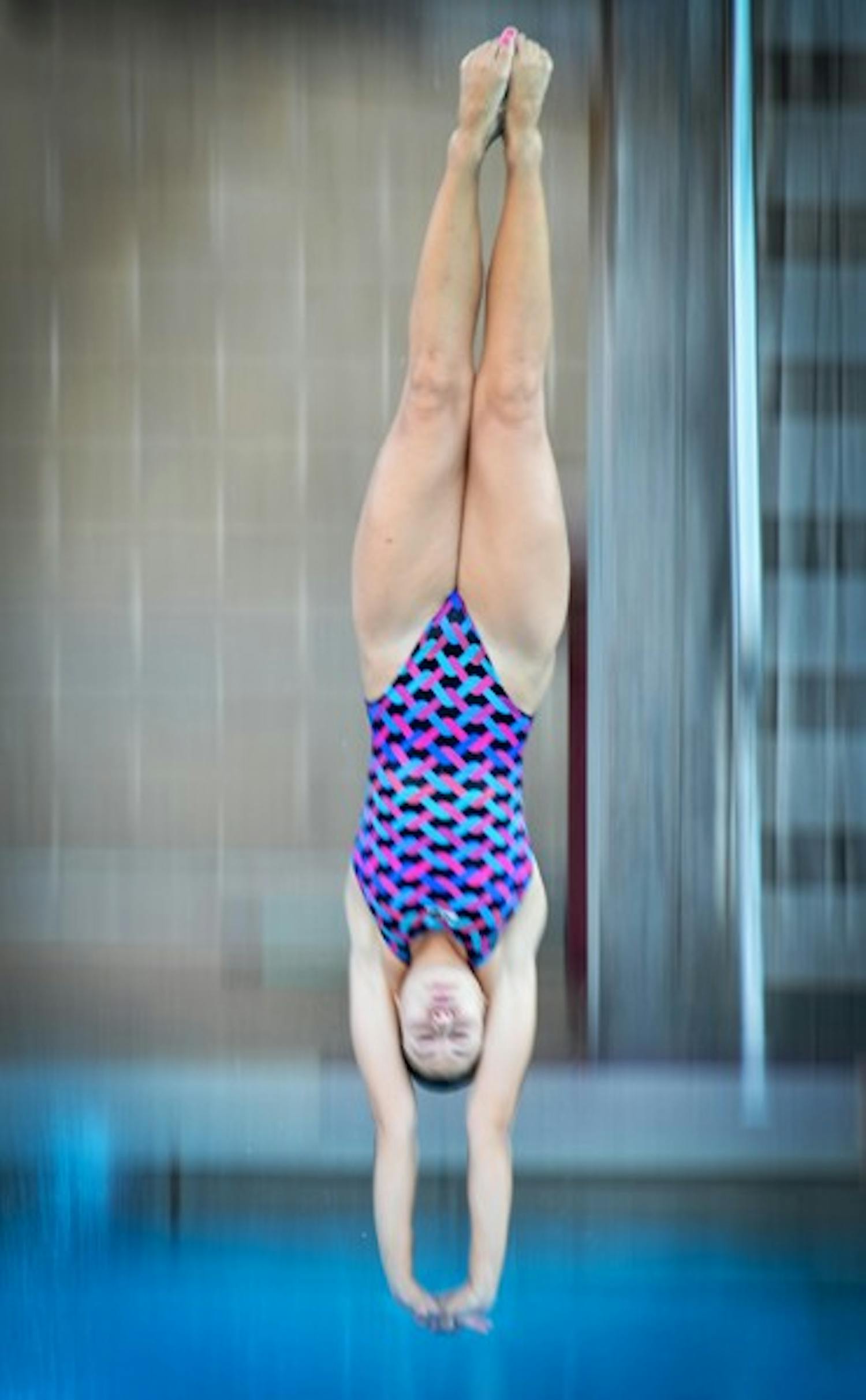 Hailey Casper dives in a practice November 2011. Casper is out for the remainder of the season with an injured shoulder. (Photo by Aaron Lavinsky)