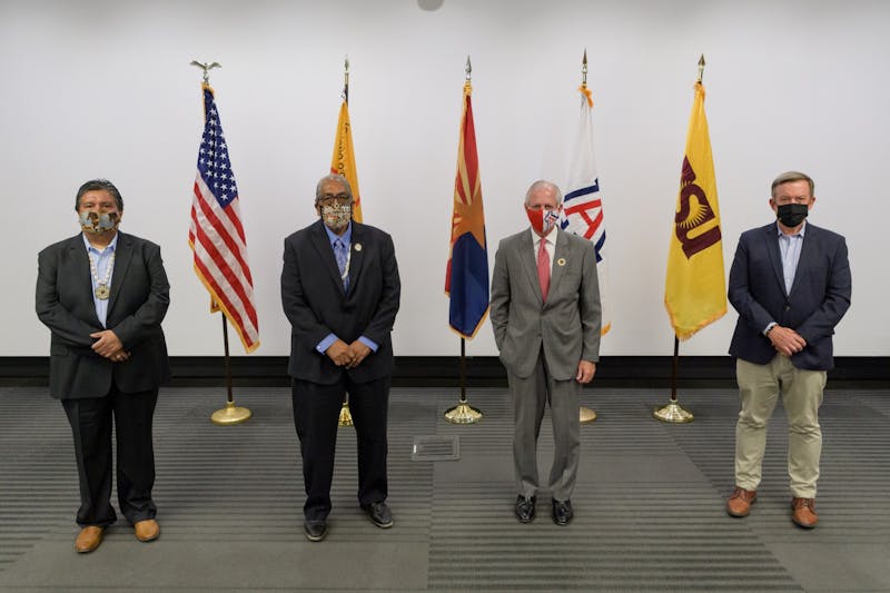 (From left to right) Tohono O’odham Council Chairman Timothy Joaquin, Tohono O’odham Chairman Ned Norris Jr., UA President Robert Robbins and ASU President Michael Crow pose for a photo during at a press conference announcing the Tohono O'odham Nation's donation to the two schools for COVID-19 research on Monday, October 19, 2020.