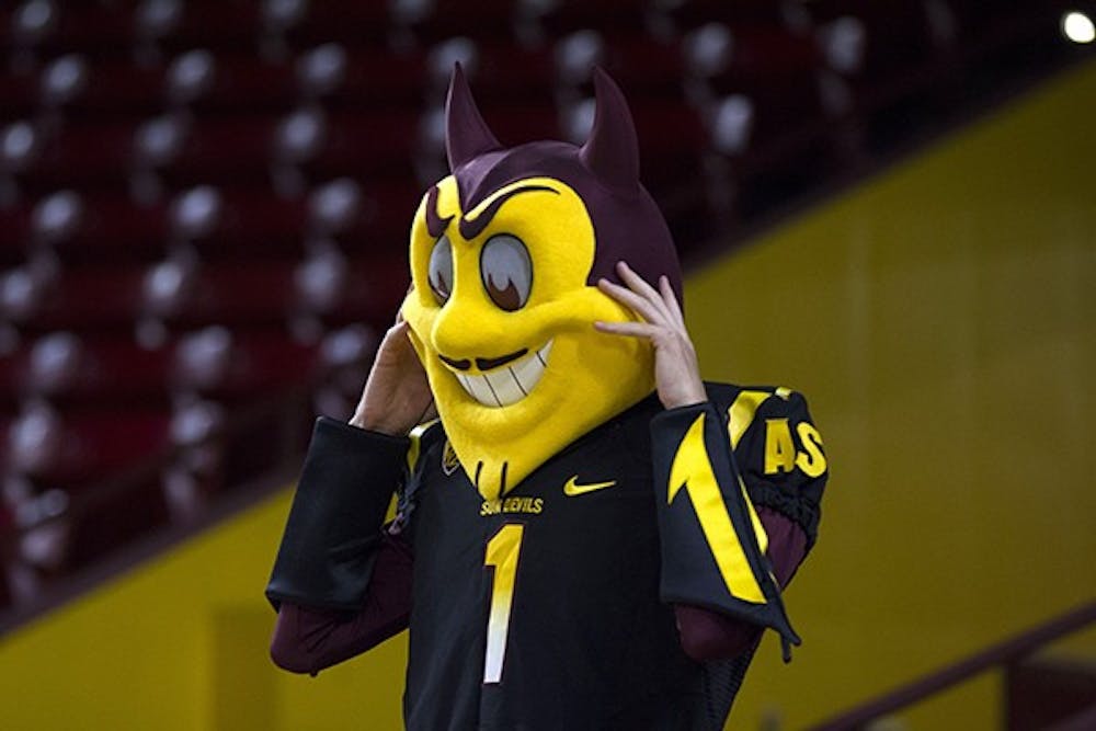 A current Sparky mascot waits for the start of the Sparky tryouts in Wells Fargo Arena on April 9. (Photo by Diana Lustig)
