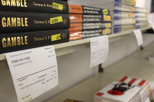 PRICE OF AN EDUCATION: As textbook prices increase, some students are forced to choose classes based on book costs while others try to pass classes without the required textbooks. According to a survey conducted by the Arizona Students’ Association, students pay an average of $760 per year for textbooks and 85 percent of those students pay for books out of their own pockets. (Photo by Beth Easterbrook)