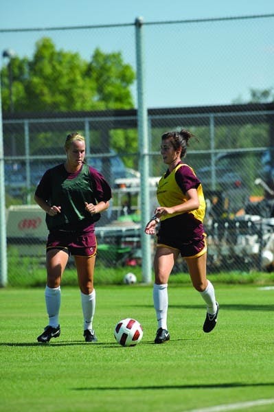 HOME FIELD: Redshirt sophomore forward Sierra Cook (left) pursues sophomore forward/defender Alyssa Freeman in practice last week. The team opens at home against Baylor Friday. (Photo by Chris Stark)