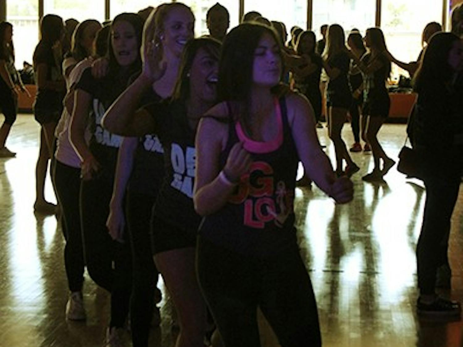 Students create a conga line  while dancing at the Dance Marathon on Feb. 22. (Photo by Alexis Macklin)