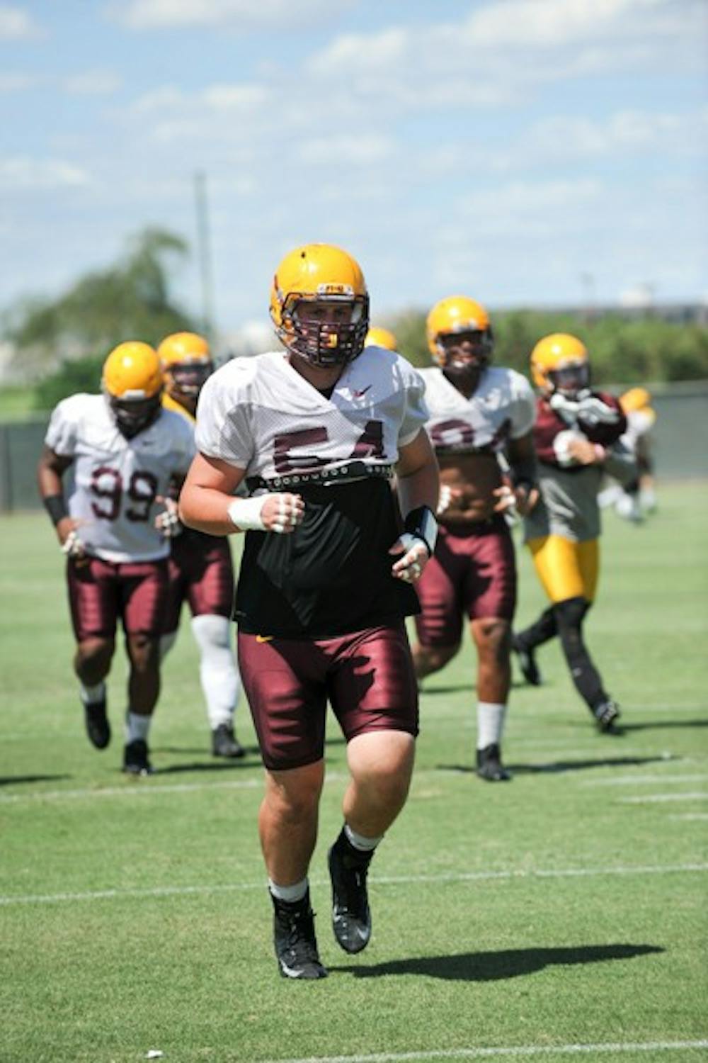 Freshman defensive lineman Connor Humphreys returns to the line after a play during a practice in Tempe. (Photo by Andrew Ybanez)