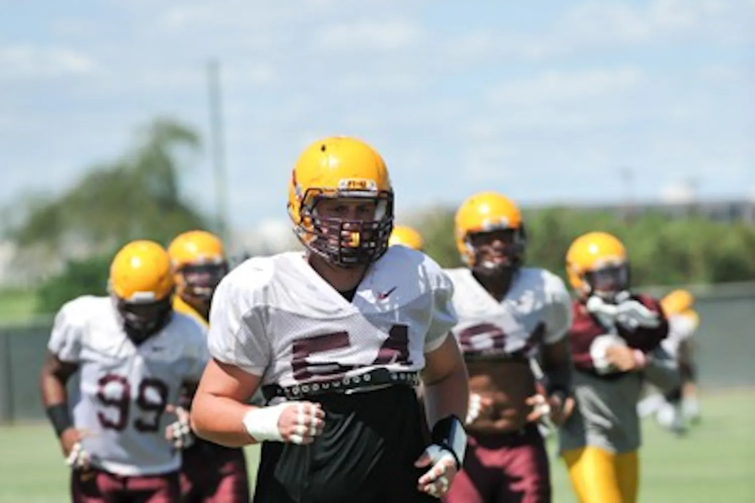 Freshman defensive lineman Connor Humphreys returns to the line after a play during a practice in Tempe. (Photo by Andrew Ybanez)