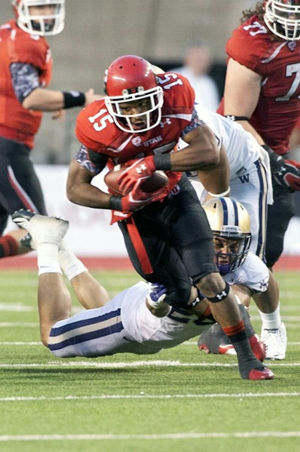 IN GOOD HANDS: Utah junior running back John White breaks free from a open-field tackle in the Utes’ 31-14 loss to Washington. White will likely see more carries against the Sun Devils on Saturday due to an injury to junior starting quarterback Jordan Wynn. (Photo courtesy The Daily Utah Chronicle)