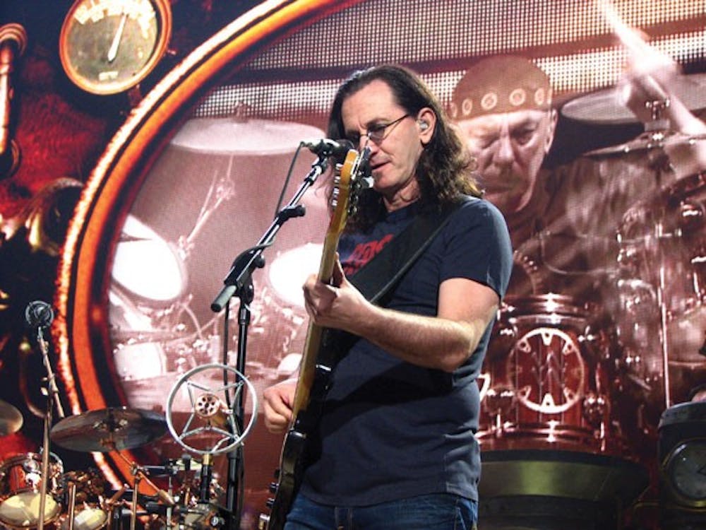 Bassist, vocalist and pianist Geddy Lee, of the band Rush, jams out on his bass during the group's 2011 Time Machine Tour in Phoenix on June 16. (Photo by Travis McKnight)