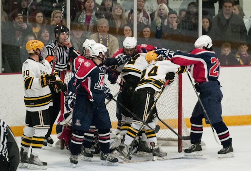 Senior forward Phil Sansone throws a punch at a rival UA player as tensions grew at the end of the game on Feb. 2. Sansone might be suspended for the Sun Devils' next game because of the fight. (Photo by Molly J Smith)