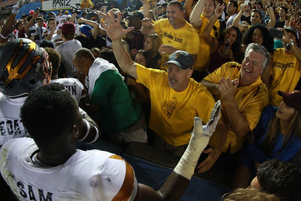 The Arizona State student section celebrates with the Sun Devil football team after an upset win against UCLA on Saturday, Oct. 3, 2015, at Rose Bowl in Pasadena, California. The Sun Devils defeated the Bruins 38-23.