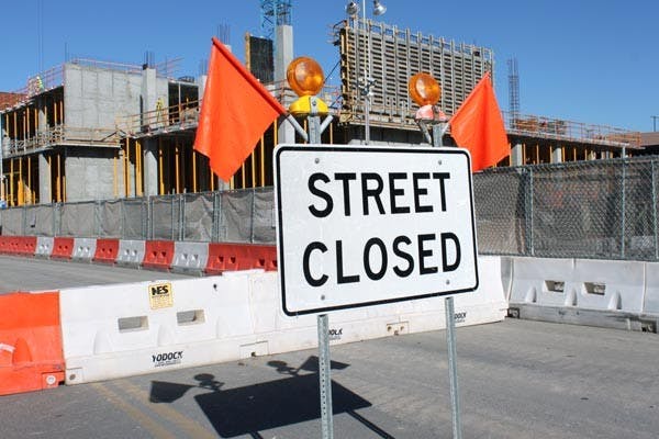 HELPING KIDS: A young girl enjoys a Thanksgiving dinner that a group of Mormon ASU students helped provide and serve at a local Boys and Girls Club for children and their families. They served over 200 meals. (Photo by Rosie Gochnour)