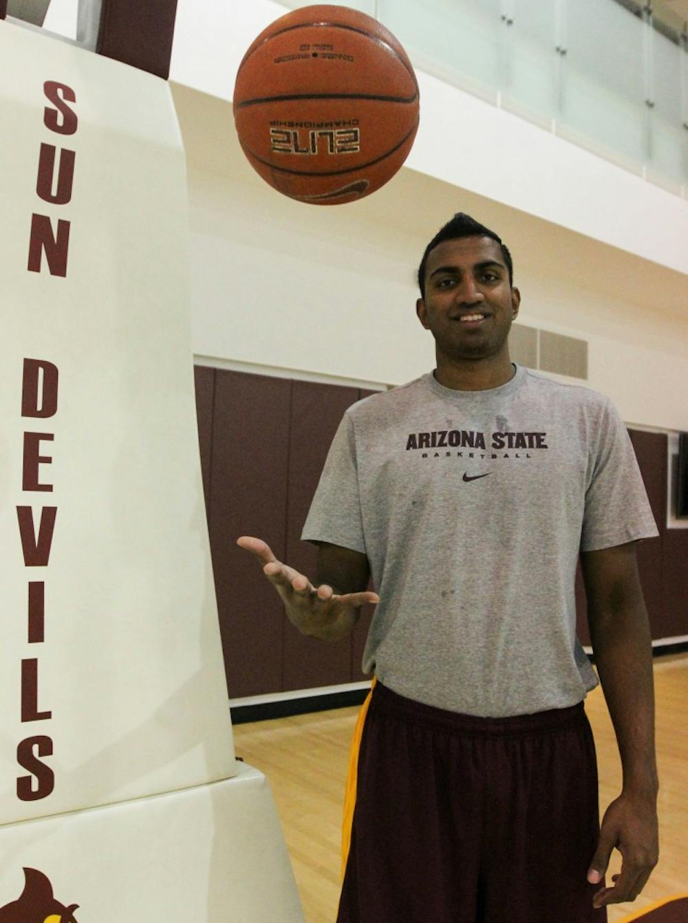 Sai Tummala, ASU's newest basketball recruit, tosses a basketball up in the air during a workout at the Tempe campus training facility. Tummala plans on studying medicine while playing for the team next semester. (Photo by Dominic Valente)