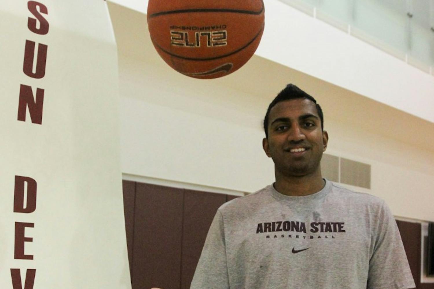 Sai Tummala, ASU's newest basketball recruit, tosses a basketball up in the air during a workout at the Tempe campus training facility. Tummala plans on studying medicine while playing for the team next semester. (Photo by Dominic Valente)