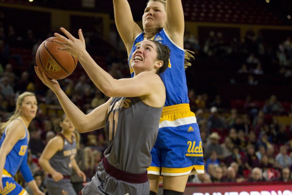 ASU freshman Robbi Ryan (11) shoots a layup while UCLA guard Kari Korver defends during a women's basketball game against the no. 15 ranked UCLA Bruins in Wells Fargo Arena in Tempe, Arizona on Sunday, Feb. 26, 2017. ASU lost 55-52.  (Josh Orcutt/State Press)